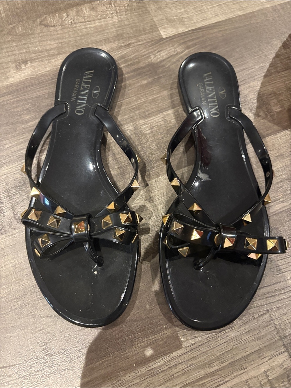 Valentino Garavani Black Jelly Bow Sandals with Gold Studs
